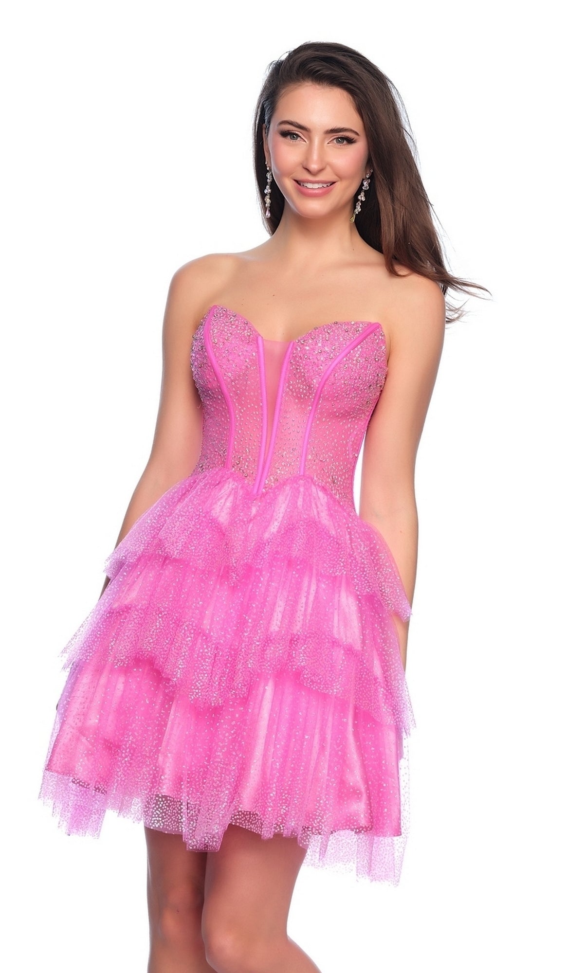 A woman poses and smiles in the Dave & Johnny Short Glitter Hoco Dress 11878, a strapless pink party dress with glitter and tiered layers, exuding homecoming elegance.